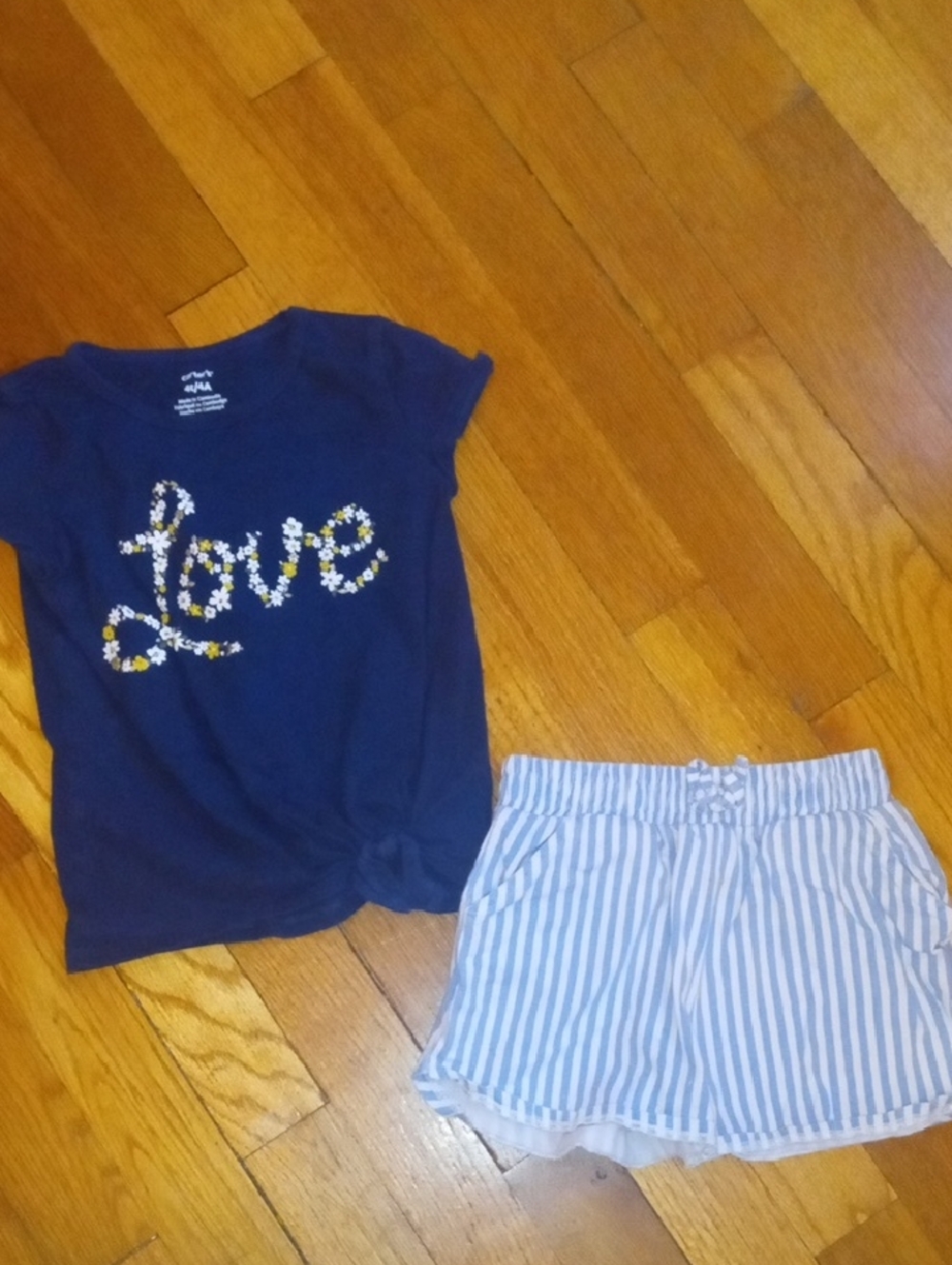 girl 4 striped shorts and navy blue tee